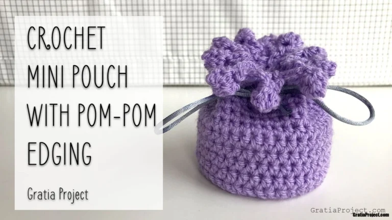 crochet mini pouch with pom-pom edging